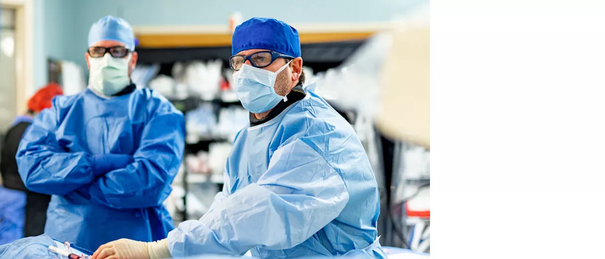 Dr. Metzger performing a cardiovascular surgery procedure in an operating room