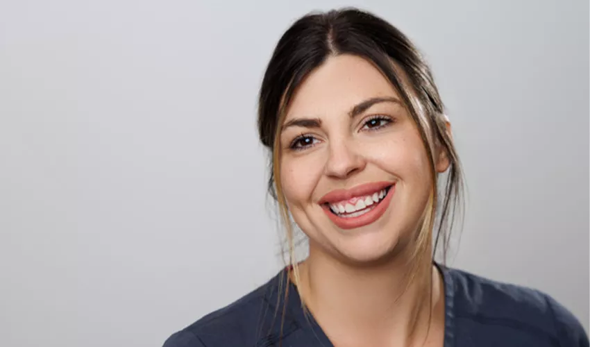 Nurse in scrubs smiling