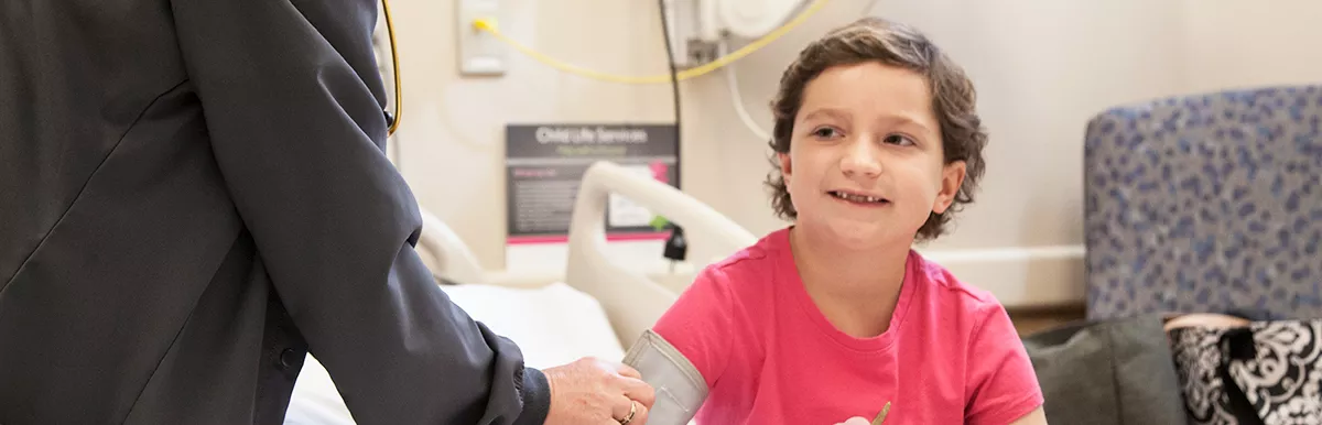 photo: pediatric patient having blood pressure taken